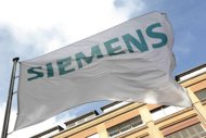German engineering giant Siemens said on Thursday it would be harder to achieve its annual profit targets, as the gloomy global economic mood weighed on orders, especially in the field of renewable energy. (AFP Photo/Michele Tantussi)