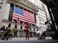 A large American flag is displayed on the front of the New York Stock Exchange on July 23. US stocks surged higher for a second straight day Friday, pushing the Dow above 13,000 for the first time since May, on hopes for US and European stimulus to jump-start frail economies. (AFP Photo/Stan Honda)