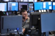 Brokers monitor market movements at the BGC Partners in London. European stock markets posted more solid gains as Germany and France backed up a staunch defence of the euro by ECB chief Mario Draghi and the US reported better than expected growth in the second quarter. (AFP Photo/Ben Stansall)