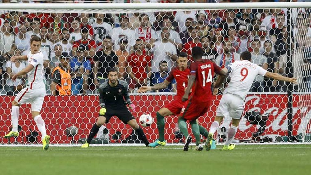 portugal beat poland on penalties to reach semi finals