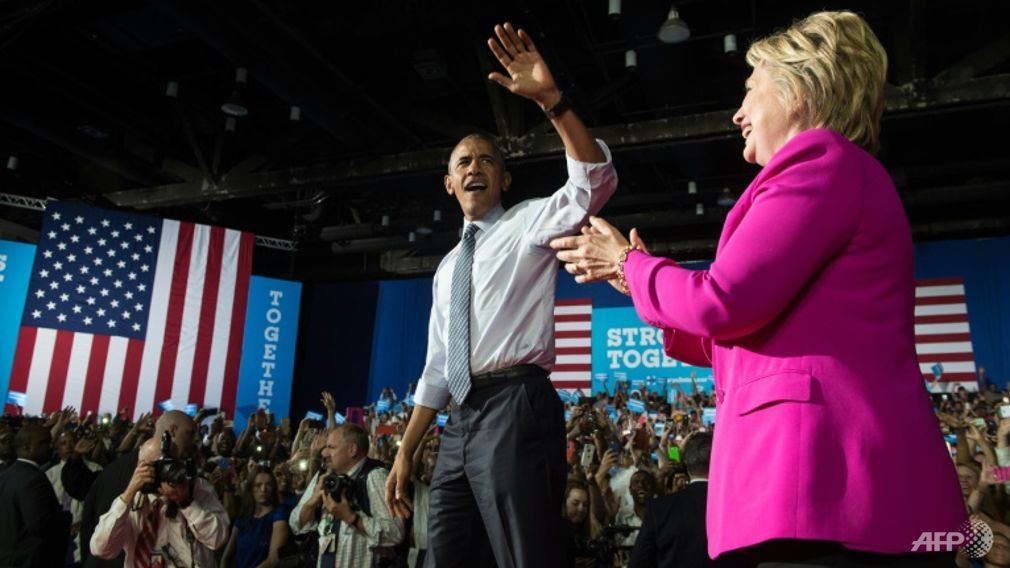 obama says ready to pass the baton to clinton