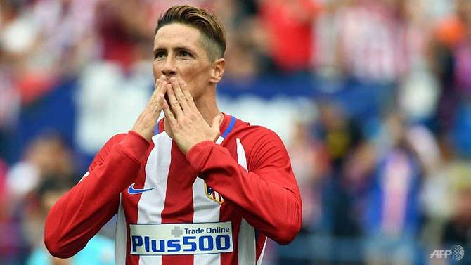 Torres extends Atletico deal for an extra year