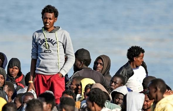 EU migrant policy suffers blow as Italy, Libya reject proposals