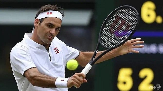 federer posts new slam record as favourites cruise into wimbledon last 16