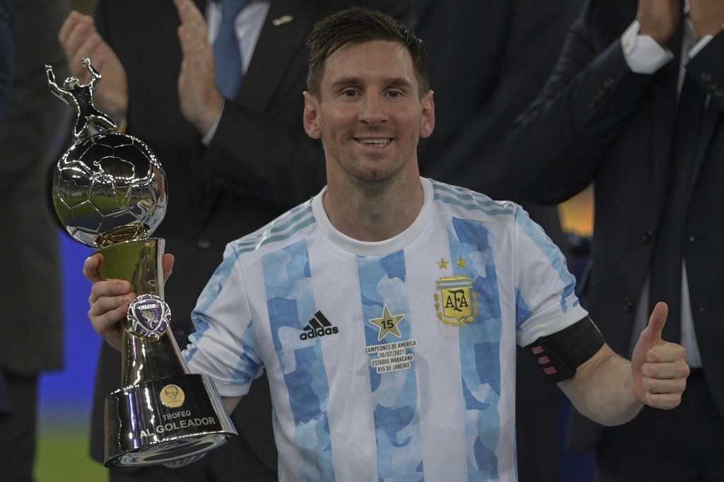Argentina's Lionel Messi holds the trophy for the championship's Top Scorer after winning the Conmebol 2021 Copa America football tournament final match against Brazil at Maracana Stadium in Rio de Janeiro, Brazil, on July 10, 2021. CARL DE SOUZA / AFP