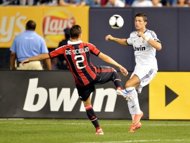Cristiano Ronaldo (R) of Real Madrid fights for the ball with Mattia De Sciglio of AC Milan during their friendly match, on August 8, at Yankee Stadium in New York. Real Madrid won 5-1. (AFP Photo/Stan Honda)