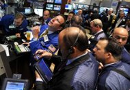 Traders work on the floor of the New York Stock Exchange on August 8. US stocks gave up early gains helped by a better-than-expected reading on retail sales to close flat Tuesday, with the Dow held up by a strong performance from Home Depot. (AFP Photo/Stan Honda)