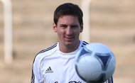 Argentinian Lionel Messi plays the ball during a public training session. Argentina coach Alejandro Sabello says Messi needs to be left in peace and one should 