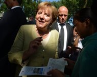 Rocky road ahead for Merkel as crisis, polls loom