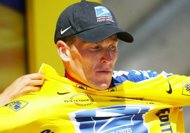 Lance Armstrong dons the iconic yellow jersey, covered with the Nike logo, during the 2002 Tour de France. Nike said it would stand by Armstrong after the US Anti-Doping Agency stripped the cycling legend of his record seven Tour de France titles. (AFP Photo/Olivier Morin)