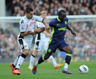 Fulham's US midfielder Clint Dempsey (L) vies with Wigan Athletic's English midfielder Victor Moses (R) in April. Chelsea finally completed their swoop for Moses he passed a medical and agreed personal terms with the European champions. (AFP Photo/Olly Greenwood)