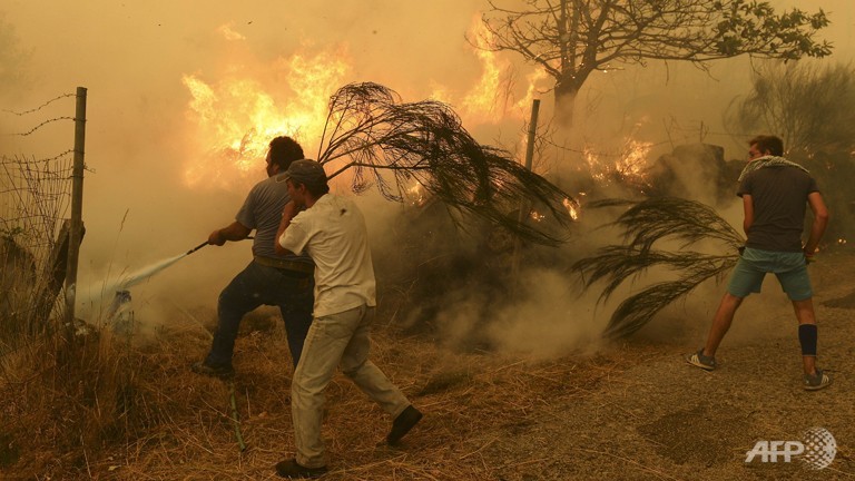 wildfires rage in spain portugal as fourth firefighter killed