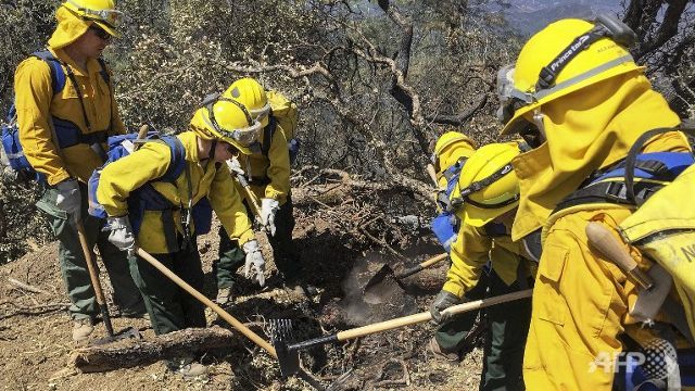 nearly 30000 firefighters battling western us blazes