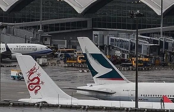 more than 100 flights cancelled at hong kong airport