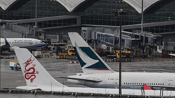 more than 100 flights cancelled at hong kong airport