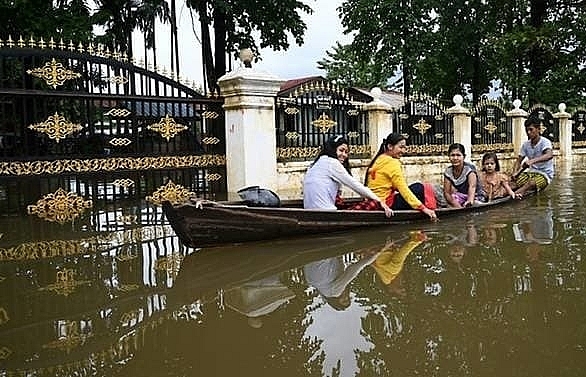 Myanmar floods force tens of thousands from homes