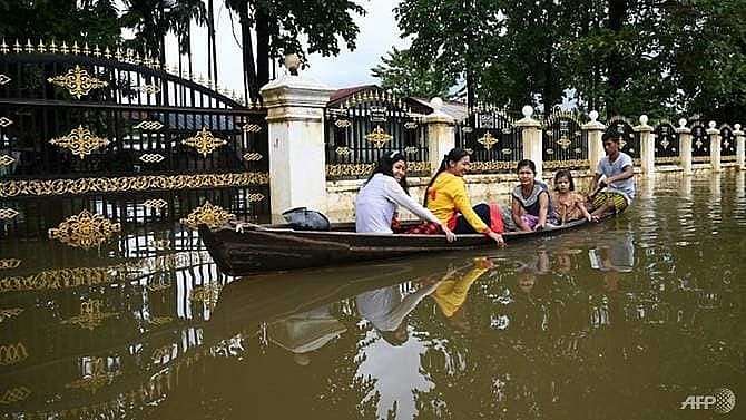 myanmar floods force tens of thousands from homes