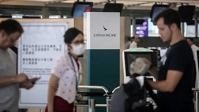 cathay pacific suspends pilot fires 2 ground employees over hong kong protests