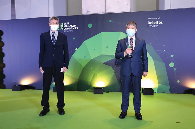 KinderWorld chairman Ricky Tan (right) and CEO of Deloitte Singapore Cheung Pui Yuen at the Best Managed Companies ceremony in Singapore last month