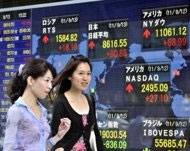 Asian markets mostly down as eurozone fears weigh