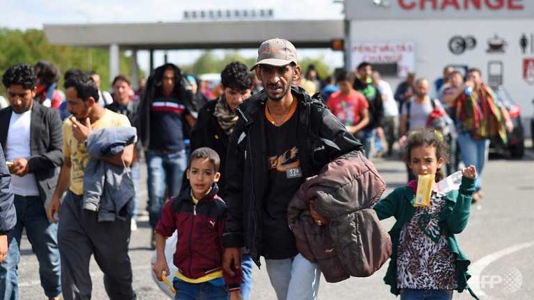 europe divided as record numbers of migrants cross into hungary