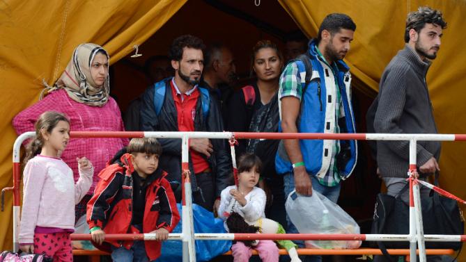 merkels welcome to refugees sparks conservative backlash