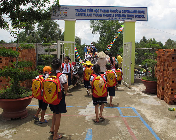 500 students of capitaland hope schools in vietnam receive new schoolbags
