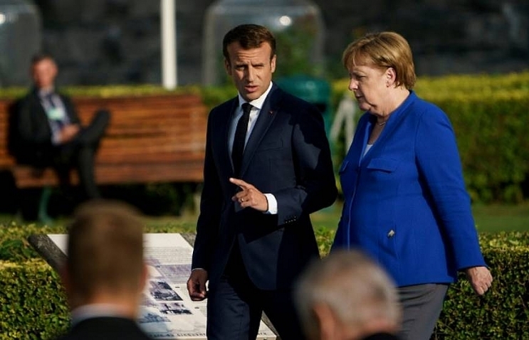 Merkel to meet Macron in Marseille amid EU immigration row