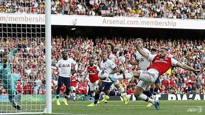 arsenal fight back to salvage point against spurs