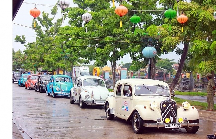 parade of classic cars in hoi an ancient town