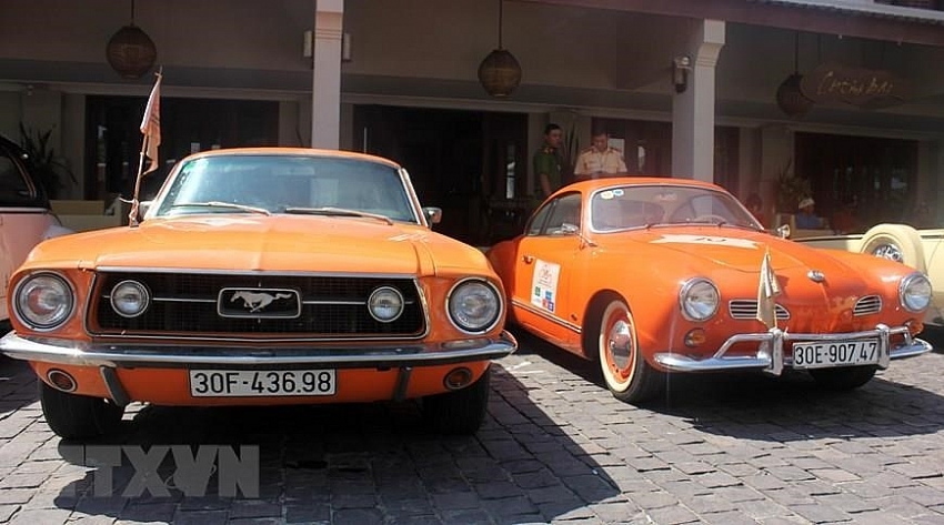 parade of classic cars in hoi an ancient town