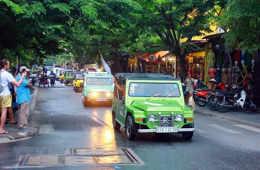 parade of classic cars in hoi an ancient town