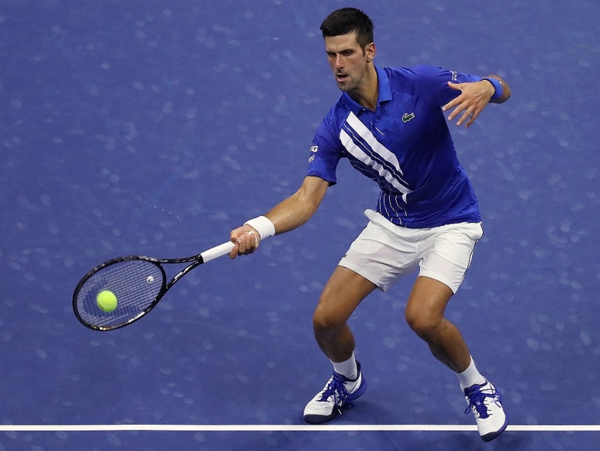 djokovic marches on at us open with straight sets win