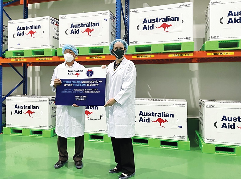 Australia handed over its first 403,000 of 1.5 million COVID-19 vaccine doses to be shared with Vietnam this year