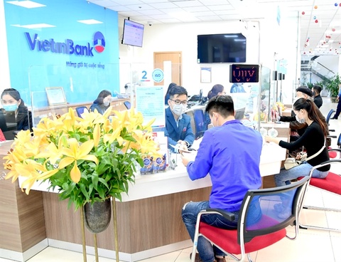 Customers make transaction in Vietinbank's branch. The lender's shares declined 1.8 per cent yesterday.-Photo vietnamplus.vn