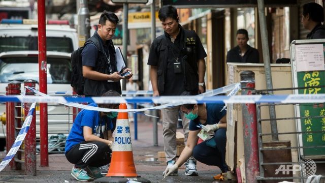 hong kong police fire shots in knife attack 3 injured