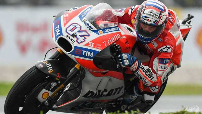 dovizioso wins in malaysia to extend title fight