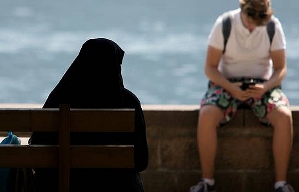 enforcing austrias burqa ban a delicate matter in alpine resort