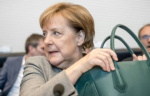 Merkel's fragile alliance faces peril of regional polls