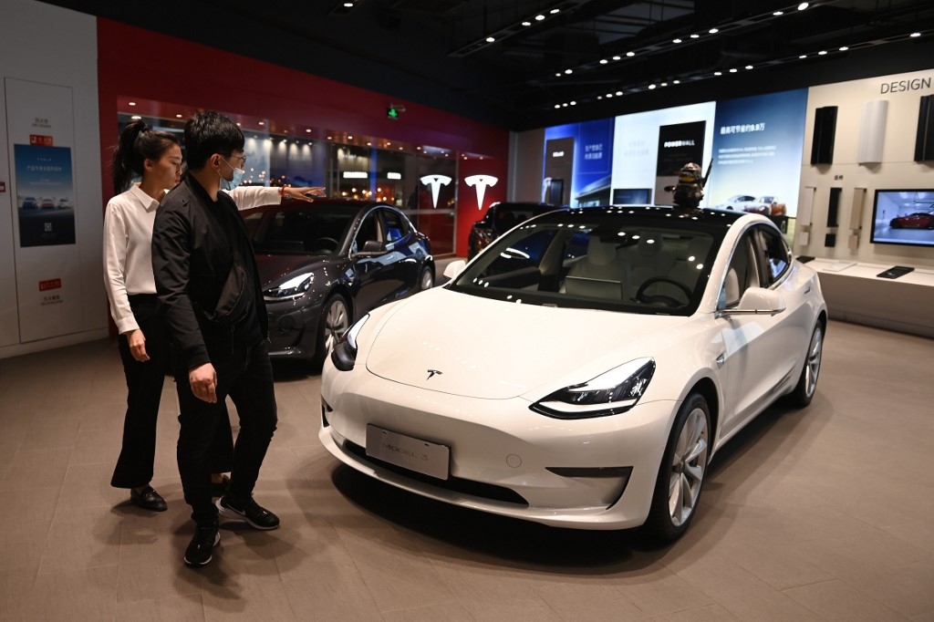tesla to recall 30000 cars from china over suspension defects
