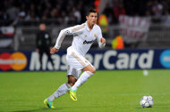 Ronaldo brings up century, Real ease into Last 16