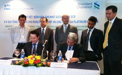 standard chartered bank and acb ties strengthened