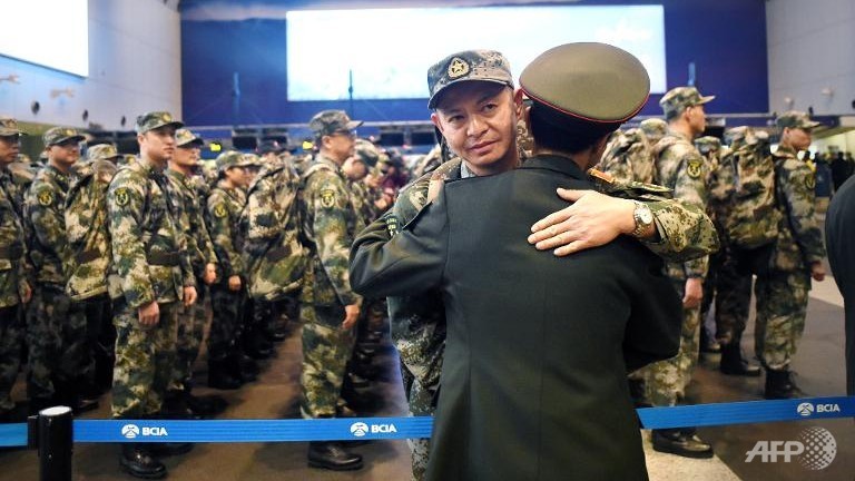 chinese medics beef up ebola fight us doctor remains ill