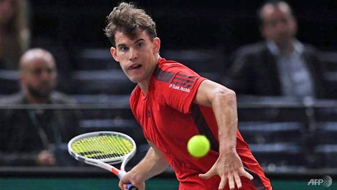 thiem edges through in paris carreno busta knocked out