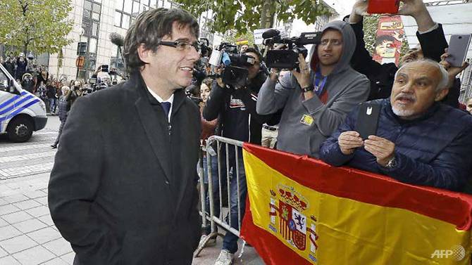 spain issues arrest warrant for ousted catalan leader