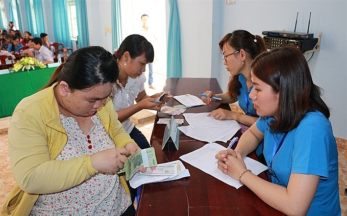 vietnamese workers in a bind as underperforming enterprises stalled insurance payment