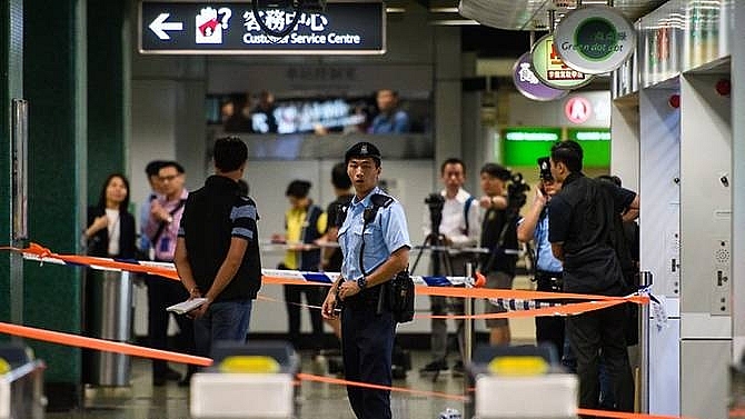 police shoot knifeman in hong kong mtr station