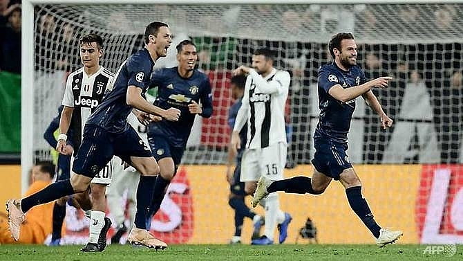 ronaldo scores but man united stun juve with two late goals