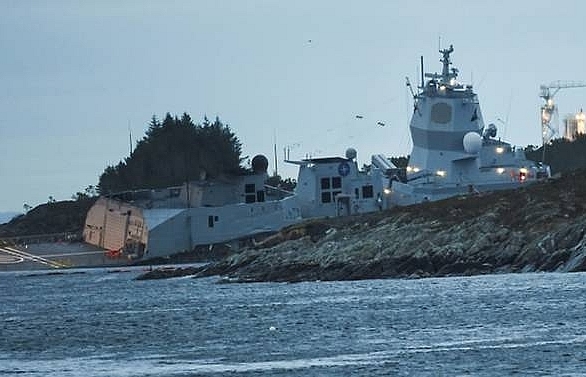 Race to stop Norway frigate sinking after oil tanker collision