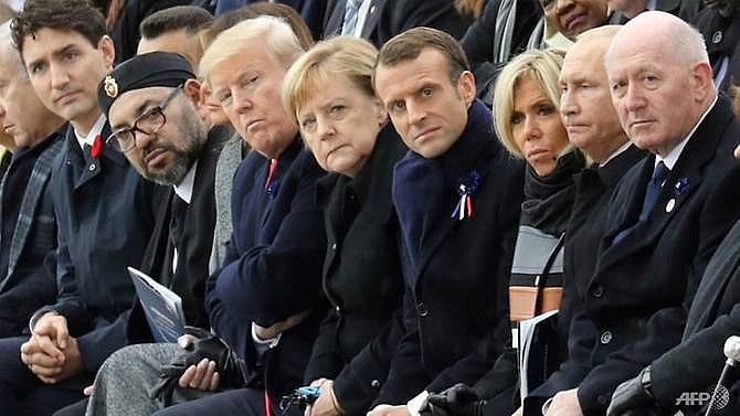 trump putin absent for leaders symbolic walk in paris rain